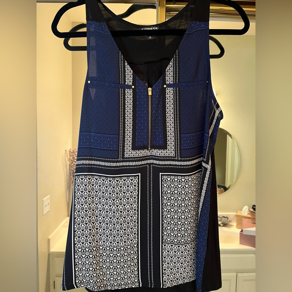 Sleeveless Navy, black and white v-neck. Hold embellishments. Never worn